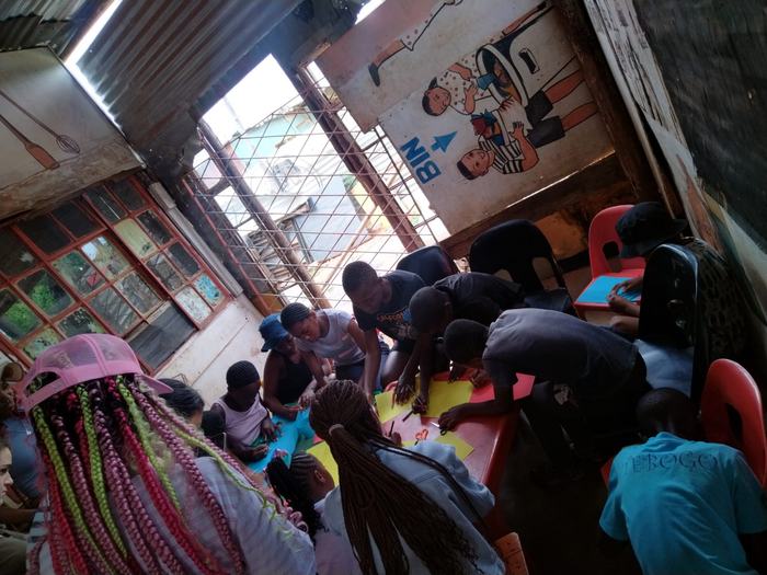 Young people working on a craft activity together at a table